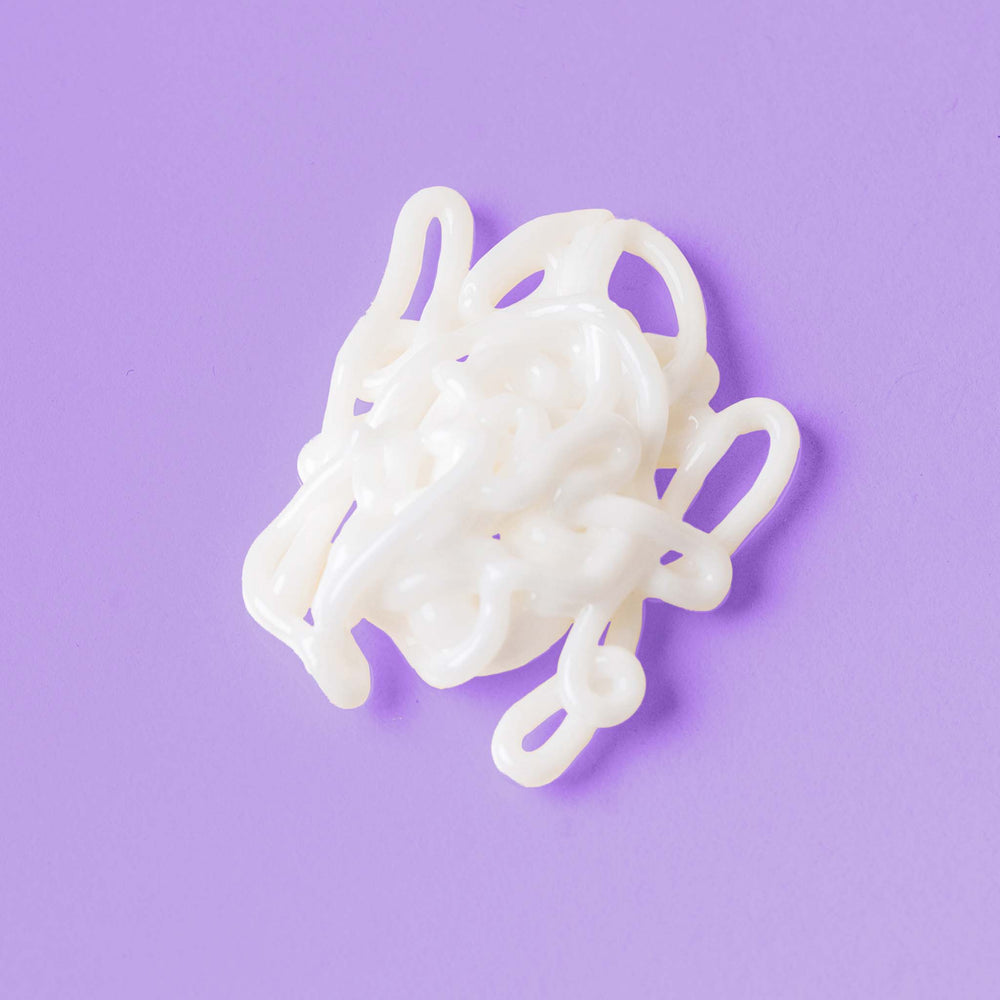 post-breakout fix cream on a purple background