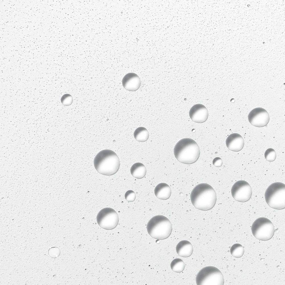 Dermalogica hyaluronic ceramide mist droplets on a textured gray surface